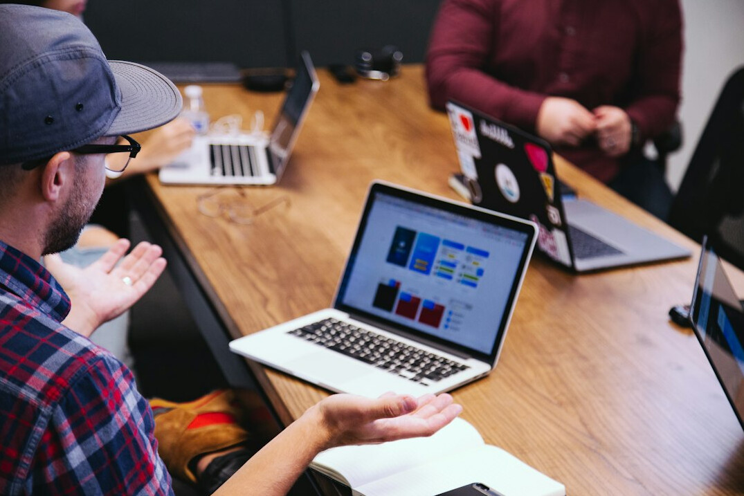 corporate team discussing software