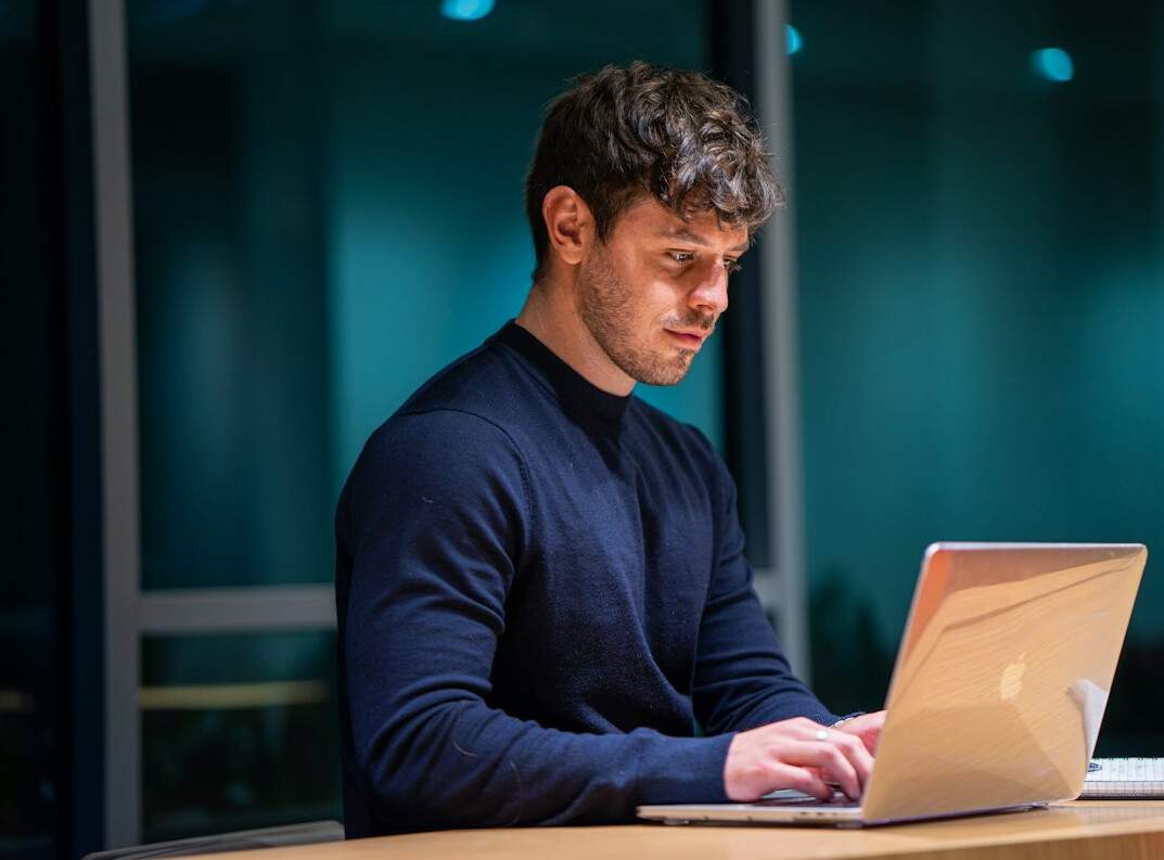 project manager using laptop in office