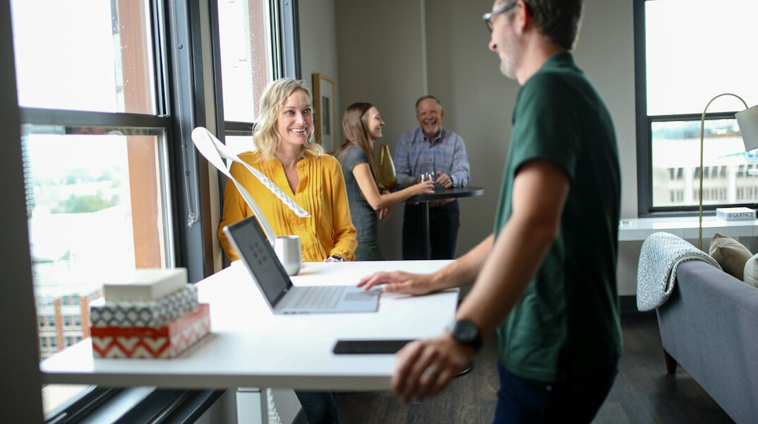Team of professionals reviewing software project in a modern office